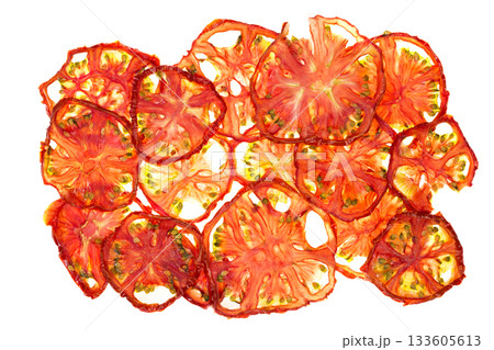 Thin slices of ripe tomato on a white background 133605613