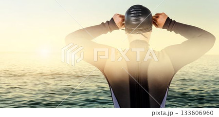 Rear view of swimmer against sea Rear view of swimmer against sea 133606960