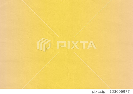 Flat design textured yellow surface is featuring subtle fabric creases and shading variations 133606977