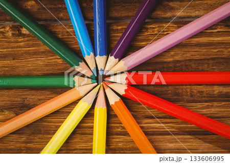Color pencils arranged on wooden table 133606995
