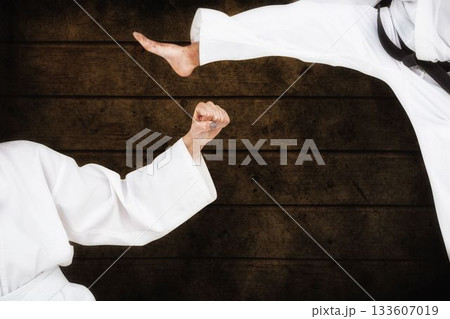 Fighters posing against wooden planks 133607019