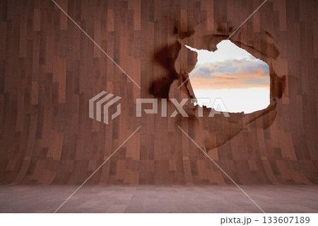 Rip on wall showing bright sky 133607189