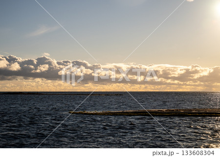 Baltic sea horizon with dramatic clouds at sunset 133608304