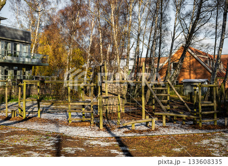 wooden outdoor playground with climbing structures in winter light wooden outdoor playground with climbing structures in winter light 133608335