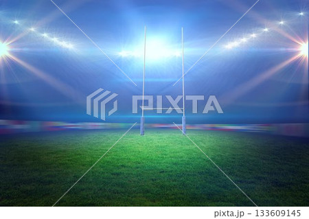 Flat design rugby goalpost is standing on lush green grass field under bright floodlights 133609145