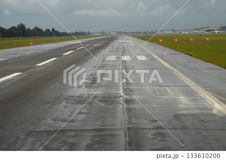bogota airport landing and taking off strip under the rain 133610200