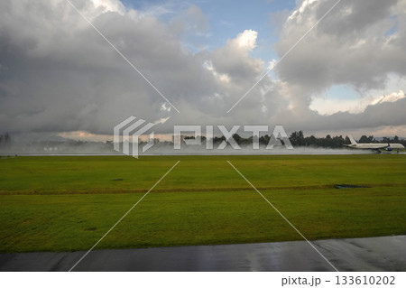 bogota airport landing and taking off strip under the rain 133610202