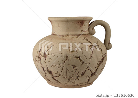 A beautifully rustic ceramic jug with a single curved handle and a distressed, textured finish 133610630