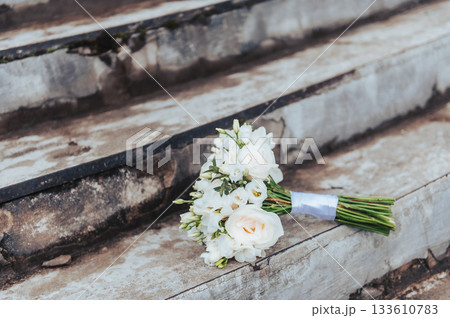 Wedding Bouquet Resting on Stone Steps in Latvia Wedding Bouquet Resting on Stone Steps in Latvia 133610783