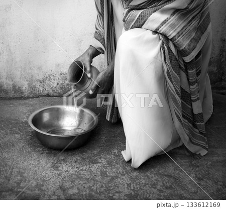 Man pour water into bowl Man pour water into bowl 133612169