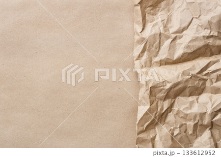 Crumpled brown kraft paper with smooth paper background Crumpled brown kraft paper with smooth paper background 133612952