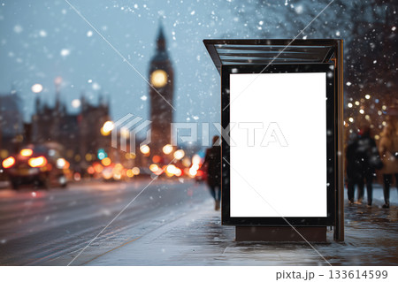 Snowy London bus stop banner with festive bokeh and blurred Big Ben backdrop 133614599