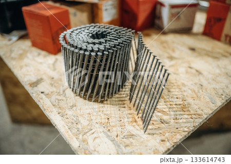 Close up view of a bunch of nails on the work bench Close up view of a bunch of nails on the work bench 133614743