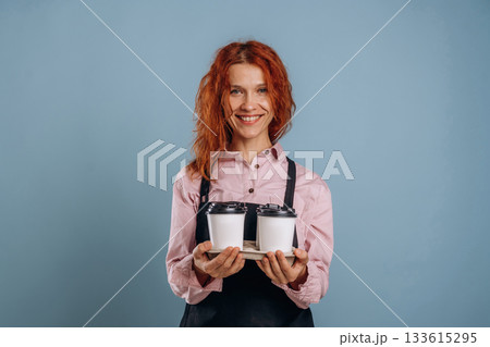 Waitress is with drinks. Woman is in the studio against background 133615295