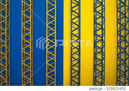 Abstract Blue and Yellow Geometric Pattern with Metallic Truss Structures 133615432