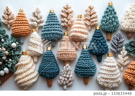 Retro style yarns. Top view. Crocheted bright Christmas trees on a white background. Christmas atmosphere. Creative hobby. Retro style yarns. Top view. Crocheted bright Christmas trees on a white background. Christmas atmosphere. Creative hobby. 133615448