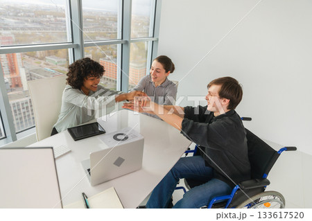 Stack of hands. Business startup teamwork unity concept. Top view of diverse multiracial business people putting hands together. Business colleagues during work process rejoice in success of company 133617520