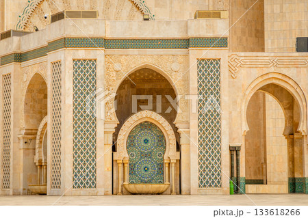Decorative arch and mosaic fountain of the Hassan II Mosque with carved stone details and traditional Moroccan zellij tilework, Casablanca, Morocco 133618266