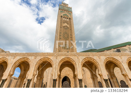 Tall minaret and ornate lower arches with Moroccan mosaic details at the Hassan II Mosque, Casablanca, Morocco 133618294