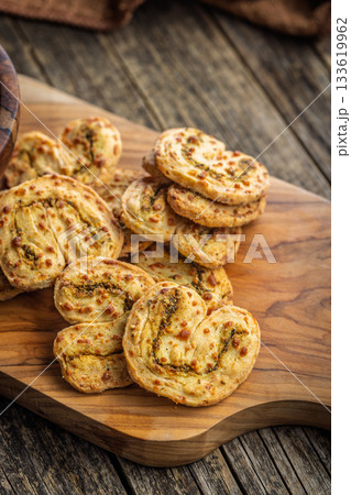 Crunchy salted crackers on wooden table. 133619962