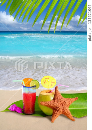 coconut red cocktail with starfish in tropical beach 133621062