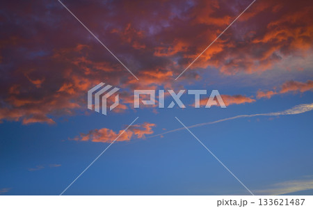 Sunset sky clouds orange and blue Sunset sky clouds orange and blue 133621487