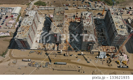 Industrial construction site with houses equipment and materials 133621935