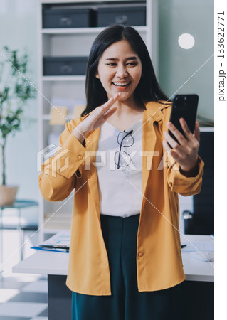 Business woman using calculator for do math finance on wooden desk in office and business working background, tax, accounting, statistics and analytic research concept. Business woman using calculator for do math finance on wooden desk in office and business working background, tax, accounting, statistics and analytic research concept. 133622771