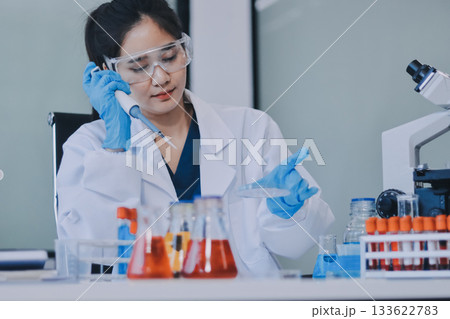 Portrait, science and happy woman on laptop in lab to research chemistry, test or innovation. Microscope, scientist and face of medical doctor in goggles for microbiology, healthcare or pharma study Portrait, science and happy woman on laptop in lab to research chemistry, test or innovation. Microscope, scientist and face of medical doctor in goggles for microbiology, healthcare or pharma study 133622783