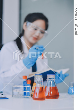 Portrait, science and happy woman on laptop in lab to research chemistry, test or innovation. Microscope, scientist and face of medical doctor in goggles for microbiology, healthcare or pharma study Portrait, science and happy woman on laptop in lab to research chemistry, test or innovation. Microscope, scientist and face of medical doctor in goggles for microbiology, healthcare or pharma study 133622790