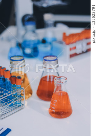 Portrait, science and happy woman on laptop in lab to research chemistry, test or innovation. Microscope, scientist and face of medical doctor in goggles for microbiology, healthcare or pharma study 133622791