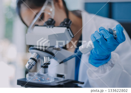 Portrait, science and happy woman on laptop in lab to research chemistry, test or innovation. Microscope, scientist and face of medical doctor in goggles for microbiology, healthcare or pharma study Portrait, science and happy woman on laptop in lab to research chemistry, test or innovation. Microscope, scientist and face of medical doctor in goggles for microbiology, healthcare or pharma study 133622802