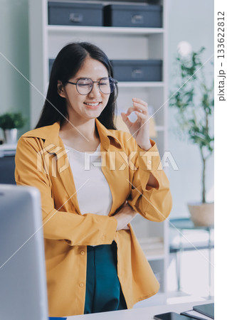 Business woman using calculator for do math finance on wooden desk in office and business working background, tax, accounting, statistics and analytic research concept. Business woman using calculator for do math finance on wooden desk in office and business working background, tax, accounting, statistics and analytic research concept. 133622812