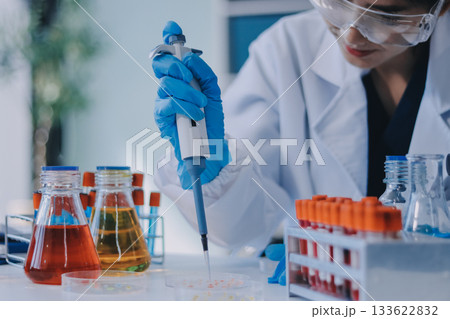 Portrait, science and happy woman on laptop in lab to research chemistry, test or innovation. Microscope, scientist and face of medical doctor in goggles for microbiology, healthcare or pharma study Portrait, science and happy woman on laptop in lab to research chemistry, test or innovation. Microscope, scientist and face of medical doctor in goggles for microbiology, healthcare or pharma study 133622832