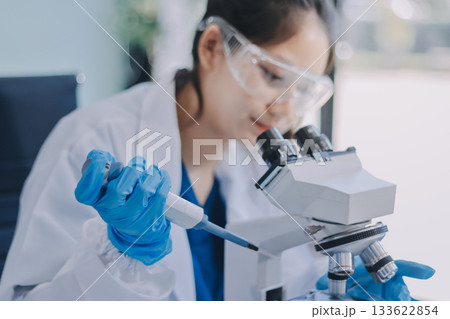 Portrait, science and happy woman on laptop in lab to research chemistry, test or innovation. Microscope, scientist and face of medical doctor in goggles for microbiology, healthcare or pharma study Portrait, science and happy woman on laptop in lab to research chemistry, test or innovation. Microscope, scientist and face of medical doctor in goggles for microbiology, healthcare or pharma study 133622854