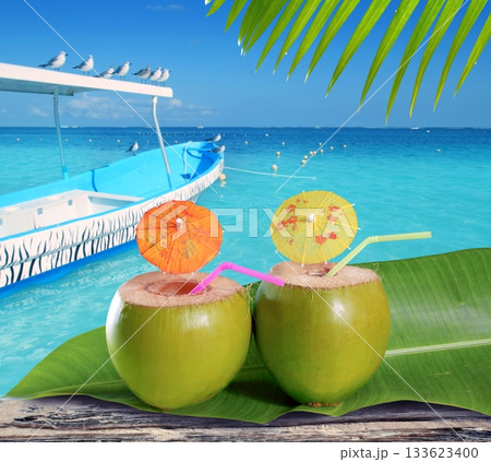 coconuts straw cocktails in tropical caribbean beach 133623400