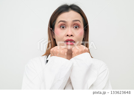 Scared Asian Healthcare Professional Doctor in White Coat Worried Studio Portrait Scared Asian Healthcare Professional Doctor in White Coat Worried Studio Portrait 133623648