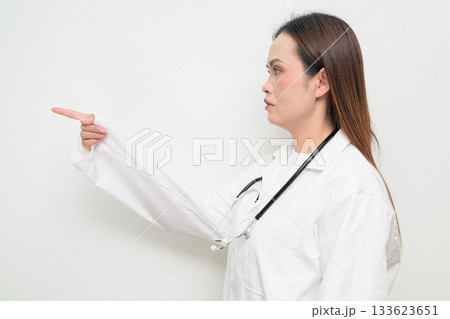Profile View of Asian Healthcare Professional Doctor in White Coat Pointing Finger 133623651