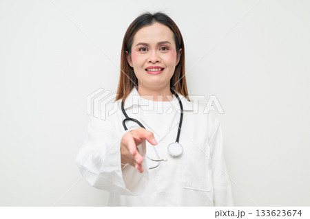 Handshake of Happy Smiling Asian Healthcare Professional Doctor in White Coat Studio Portrait 133623674