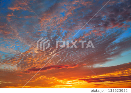 Sunset sky with orange clouds over blue Sunset sky with orange clouds over blue 133623932