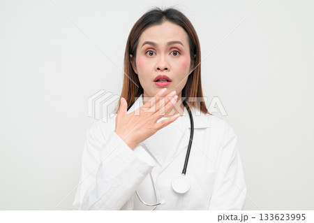 Shocked Asian Healthcare Professional Doctor in White Coat Studio Portrait Surprised 133623995