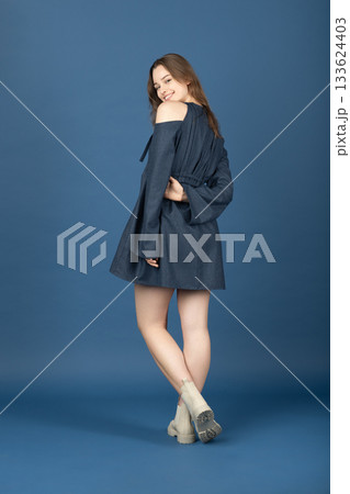 Beautiful woman with blue linen dress studio portrait Beautiful woman with blue linen dress studio portrait 133624403