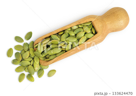 Peeled pumpkin seeds in wooden scoop isolated on white background. Top view. Flat lay Peeled pumpkin seeds in wooden scoop isolated on white background. Top view. Flat lay 133624470