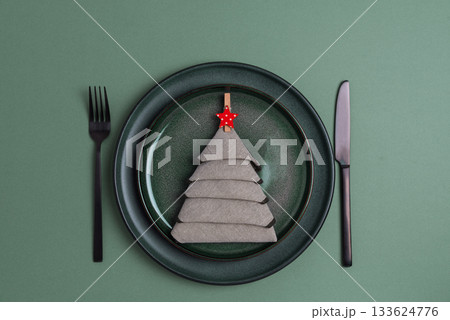 Elegant Christmas Table Setting with Napkin Tree and Red Star Ornament 133624776