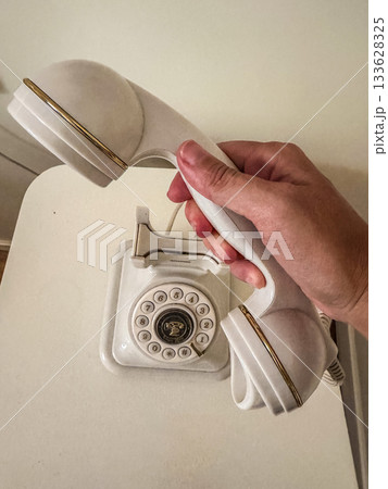 Hand Dialing Retro White Rotary Phone or Lifting Receiver - Vintage Communication Hand Dialing Retro White Rotary Phone or Lifting Receiver - Vintage Communication 133628325
