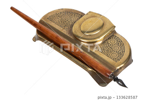 Feather quill with brass inkwell 133628587