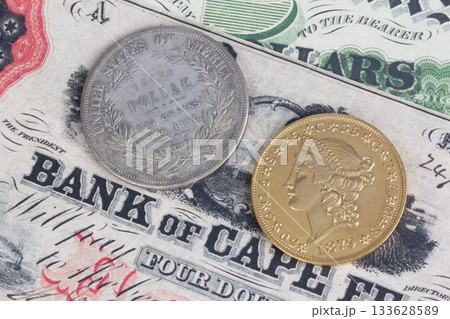 US banknotes and silver certificates with gold dollar coin 133628589