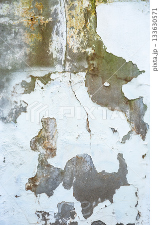 Aged weathered wall texture with cracks and peeling paint 133630571