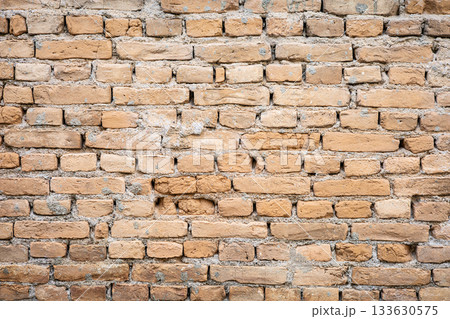 Rustic brick wall texture with red and brown tones 133630575