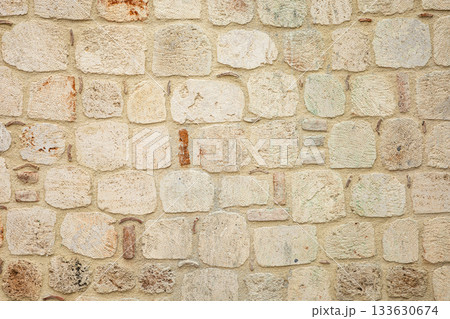 Rustic stone wall with irregular pattern and natural texture Rustic stone wall with irregular pattern and natural texture 133630674